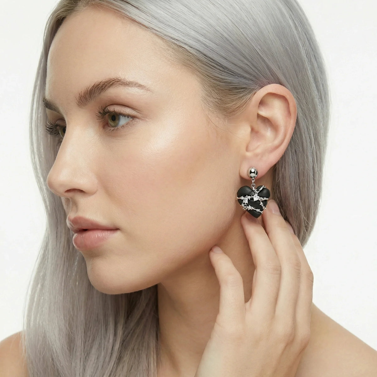 Lady with black heart earring on
