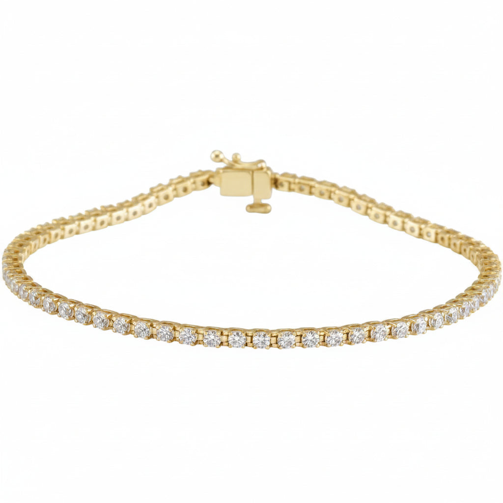 Gold bracelet with clear stones on a white background