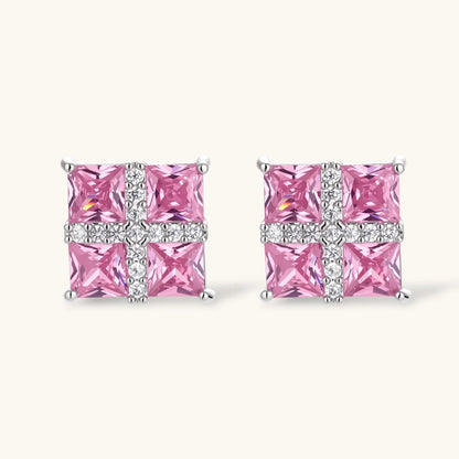 White gold plated jewelry set with pink cubic zirconia stones in geometric cross design, featuring Y-necklace and square stud earrings