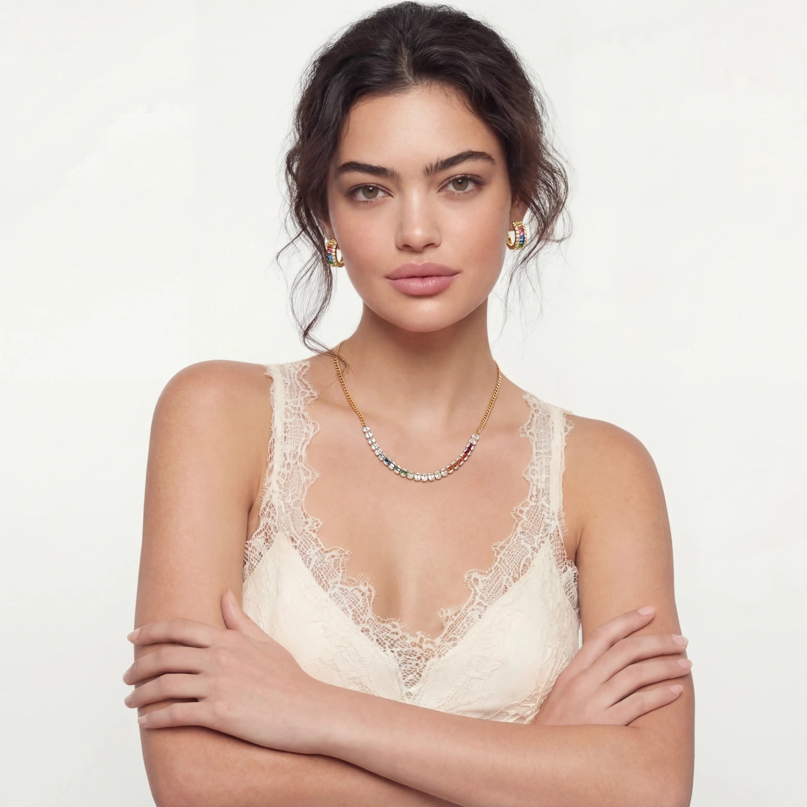 Woman wearing a lace top with a plain background