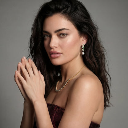 Woman wearing jewelry against a gray background