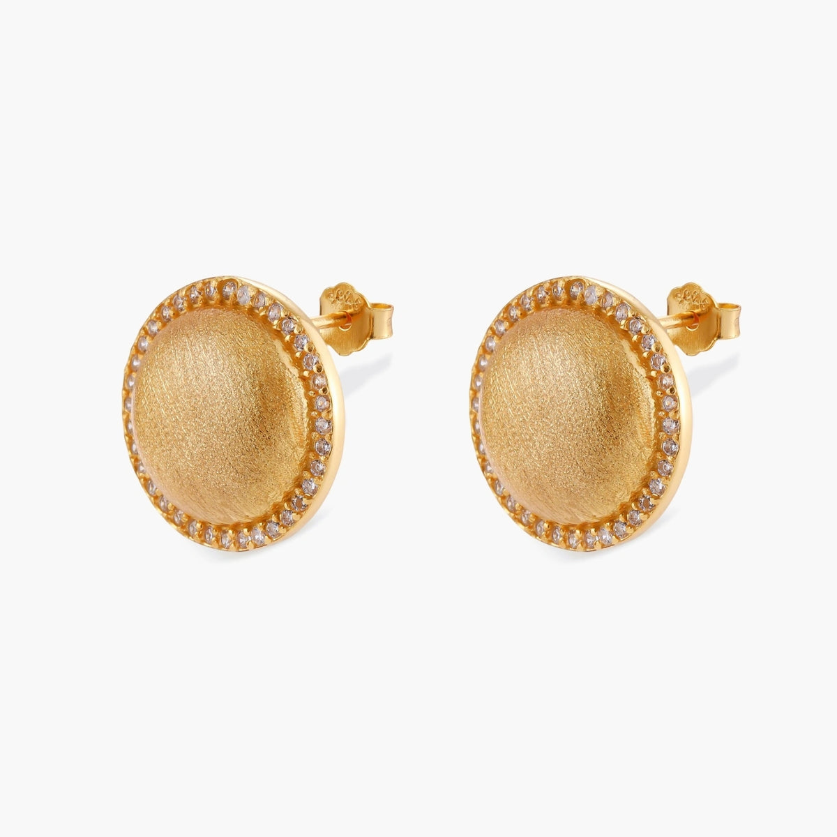 Pair of round dome stud earrings in brushed 18K gold-plated silver with a sparkling CZ halo border, push-back closure.