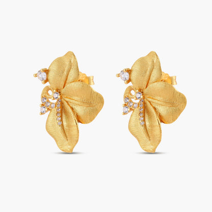 Gold-plated 925 silver flower stud earrings with brushed finish, swirl detail, and pavé cubic zirconia on cream background.