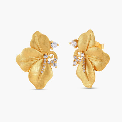 Gold-plated 925 silver flower stud earrings with brushed finish, swirl detail, and pavé cubic zirconia on cream background.