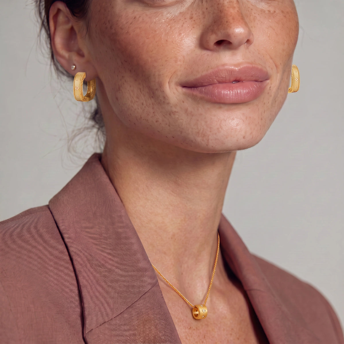 Square huggie hoop earrings in 18K gold-plated silver with ribbed texture, rope borders, floral CZ clusters, and filigree inner lace.