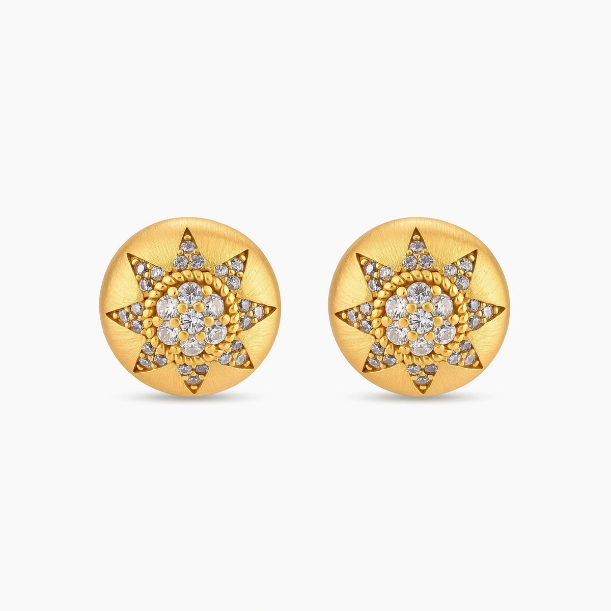 Round domed gold-plated stud earrings with brushed finish and an 8-point star paved in cubic zirconia stones.