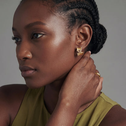 Pair of 18K gold-plated 925 sterling silver C-hoop earrings with brushed finish and scattered cubic zirconia clusters.
