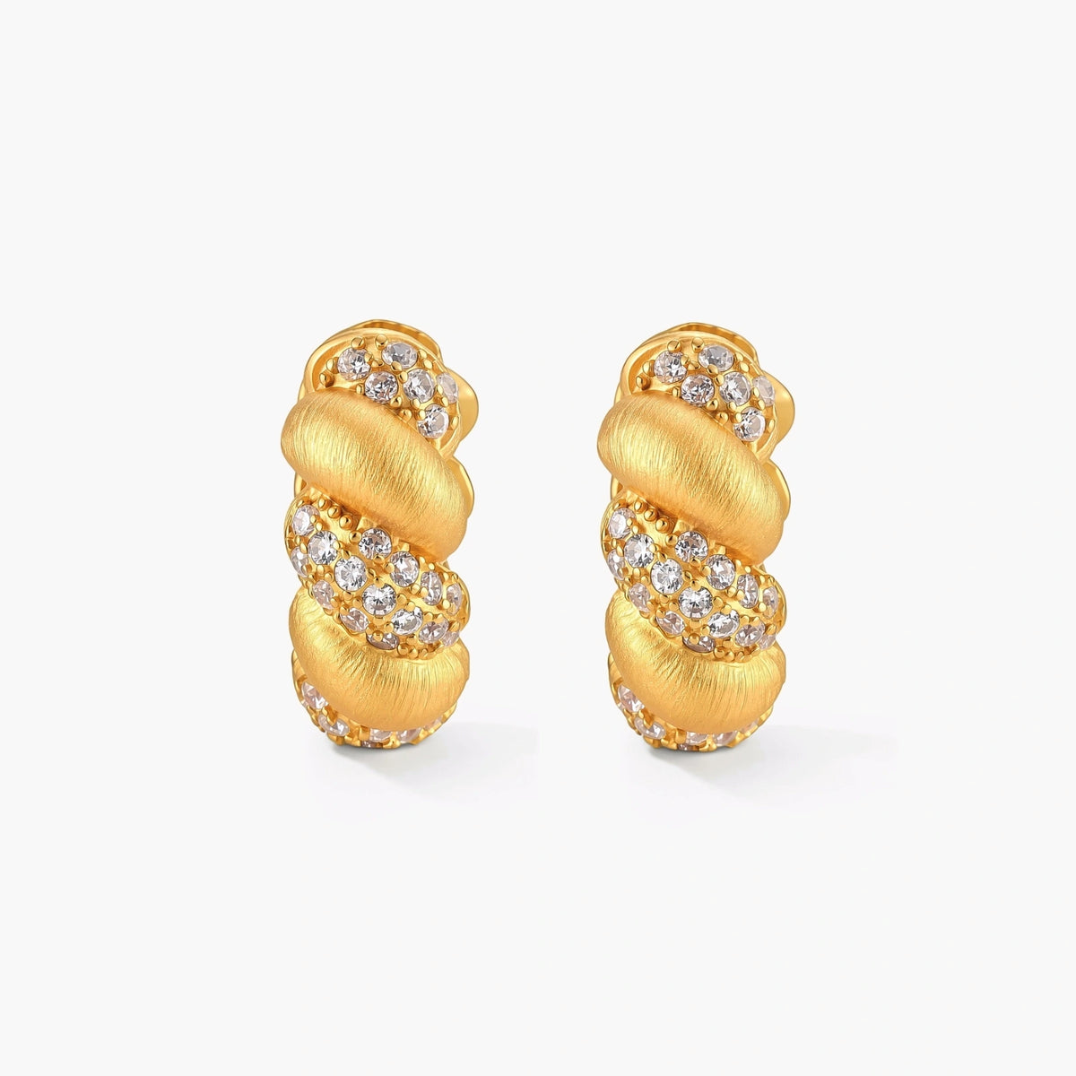 Pair of 18K gold-plated 925 silver huggie hoops with twisted braid texture and pavé cubic zirconia detailing, 15mm.