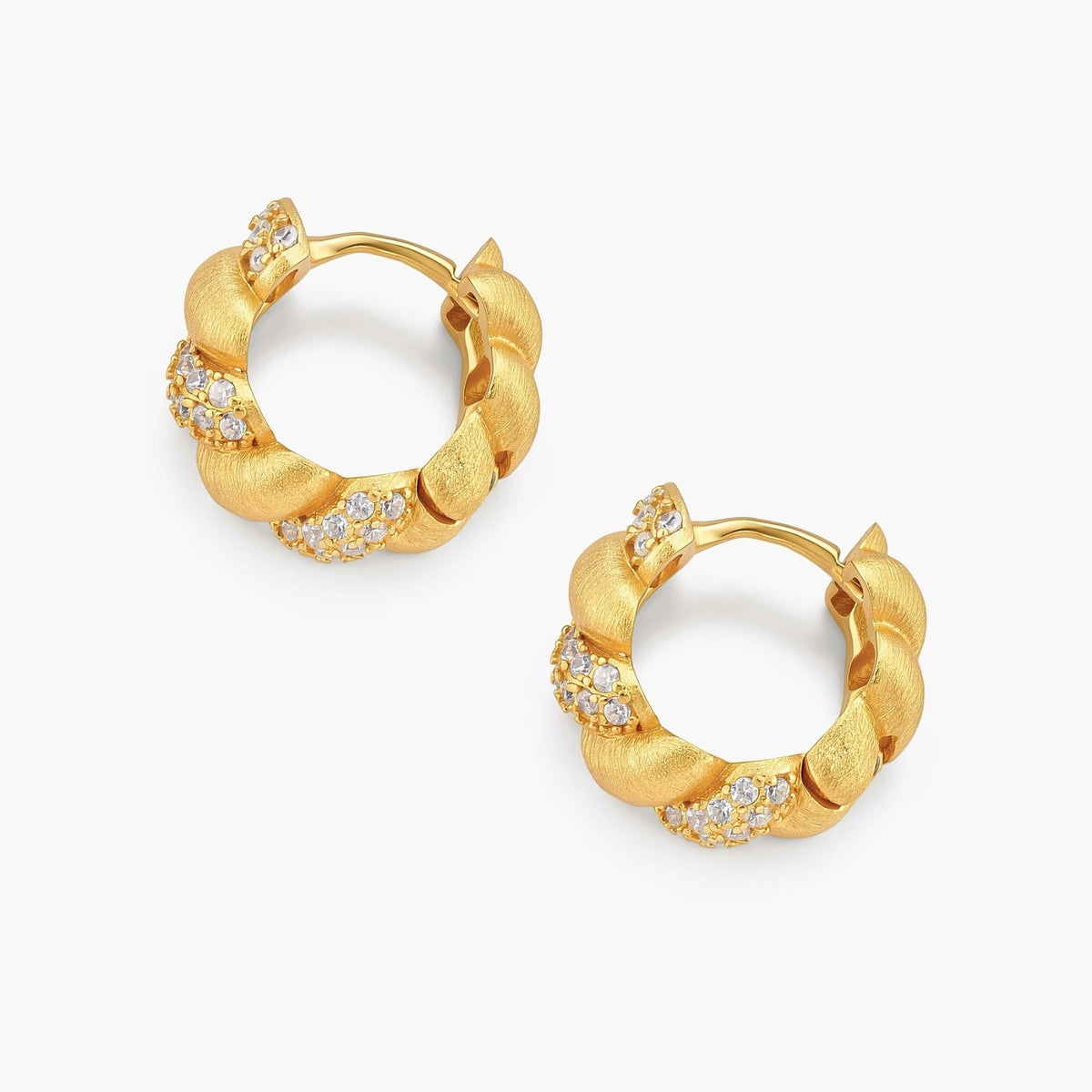 Pair of 18K gold-plated 925 silver huggie hoops with twisted braid texture and pavé cubic zirconia detailing, 15mm.