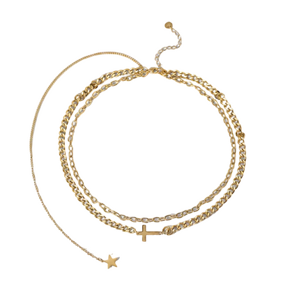 Three gold necklaces with star and cross pendants on a light gray background