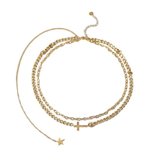 Three gold necklaces with star and cross pendants on a light gray background