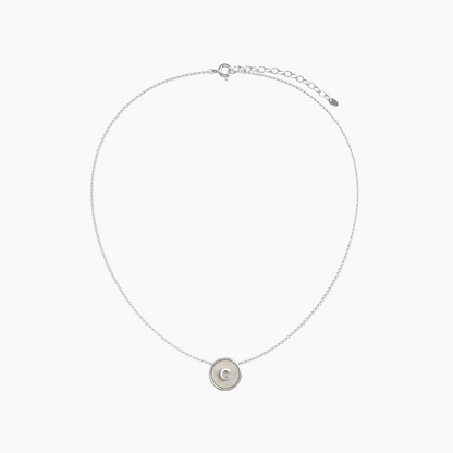 Silver plated custom necklace with a round pendant on a white background