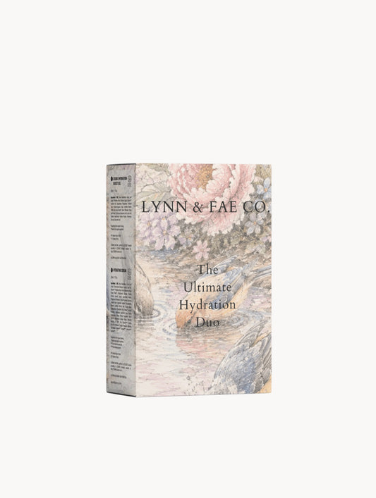A tall rectangular product box for LYNN & FAE CO. The box features a soft, vintage-style botanical illustration in pastel pink, beige, and muted blue-gray tones, with black serif text reading 'LYNN & FAE CO.